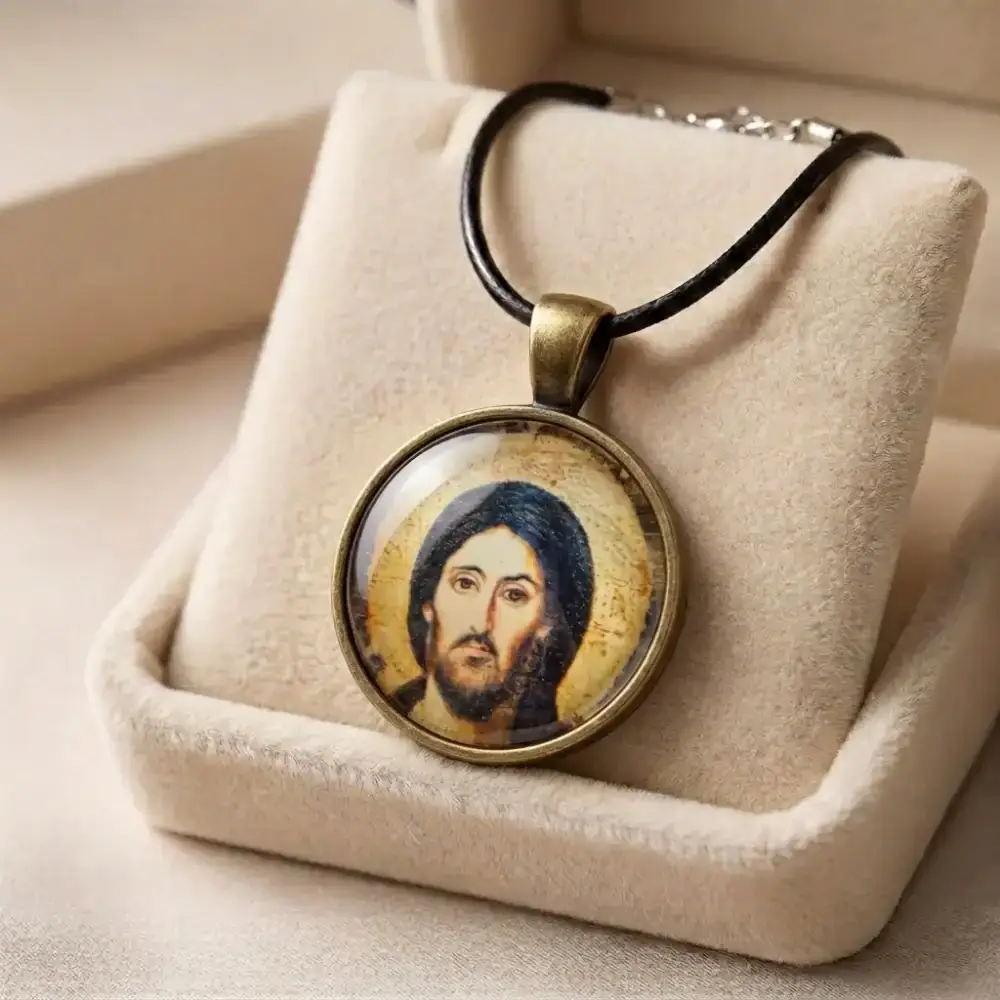 Jesus Christ Pantocrator Pendant in Velvet Gift Box Jesus Christ Pantocrator religious glass pendant necklace arranged neatly in a beige plush velvet gift box.