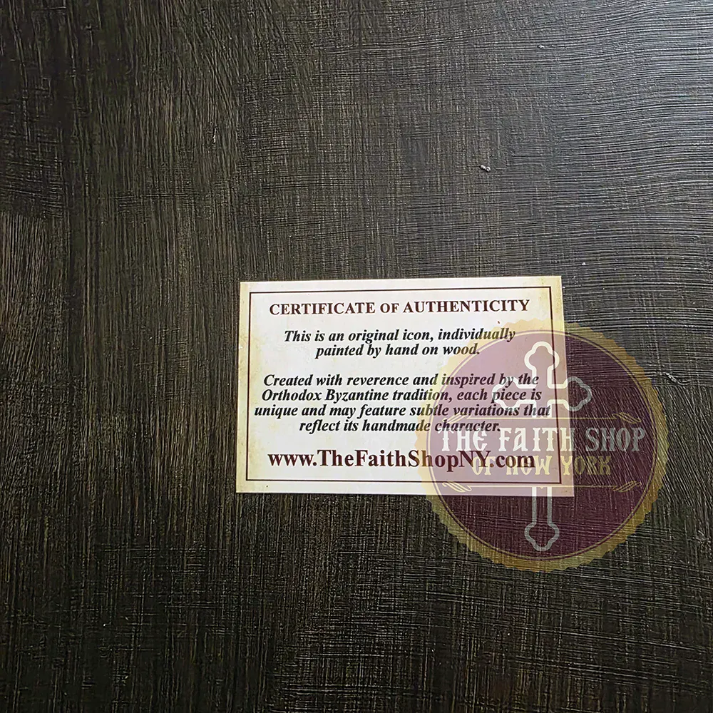 Certificate of Authenticity on Back of Hand-Painted Icon Certificate of Authenticity label on dark wood, stating an icon is hand-painted in the Orthodox Byzantine tradition.