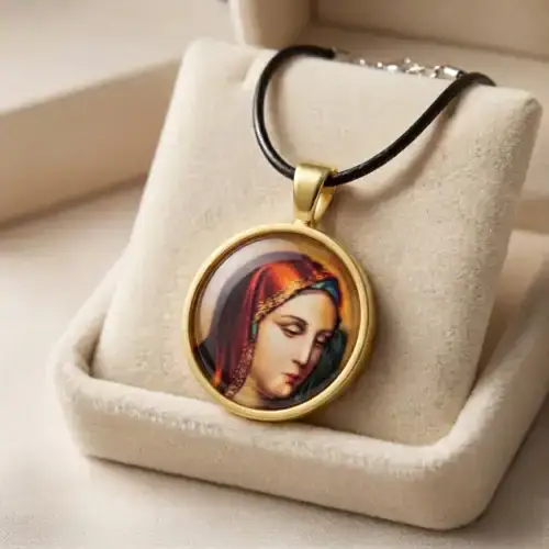 Theotokos in Grief Pendant Necklace displayed inside an open beige velvet gift box with a black cord.