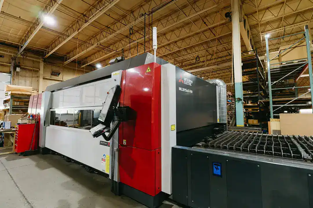Large industrial manufacturing machine in a factory setting.