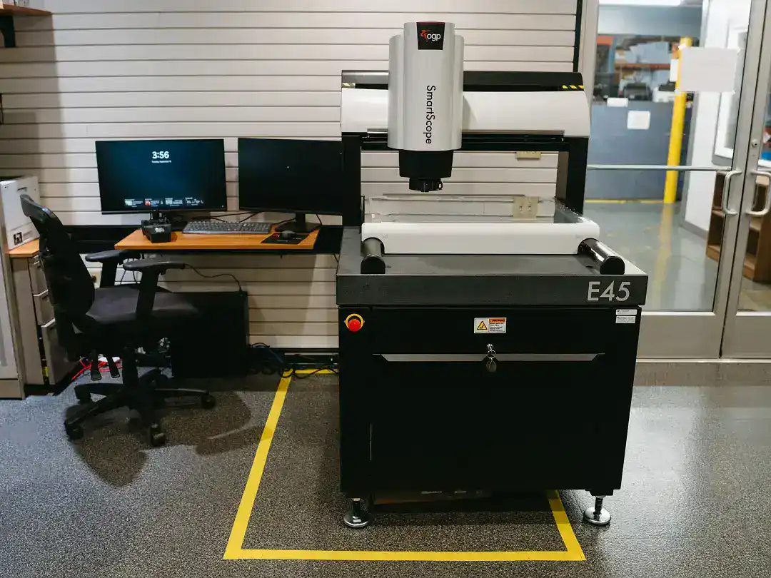 Industrial laser cutting machine in a manufacturing facility.