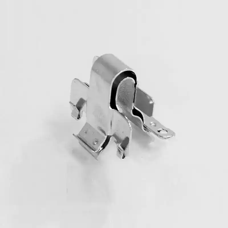 Close-up of a metallic automotive relay component for manufacturing.