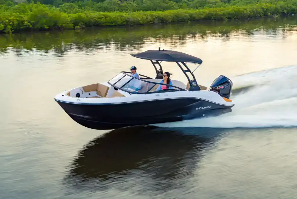 Boat cruising on a river at sunset, showcasing leisure and watercraft.