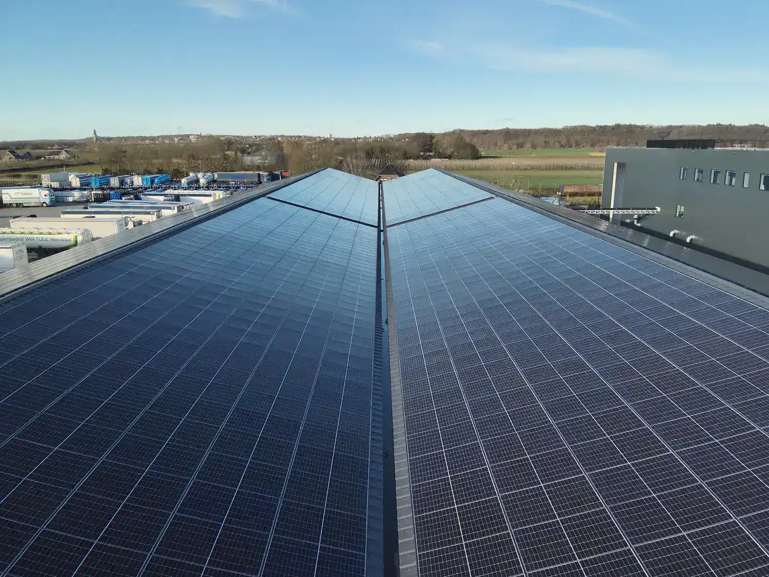 Solar panel installation on commercial roofs for sustainable energy generation in the Netherlands.
