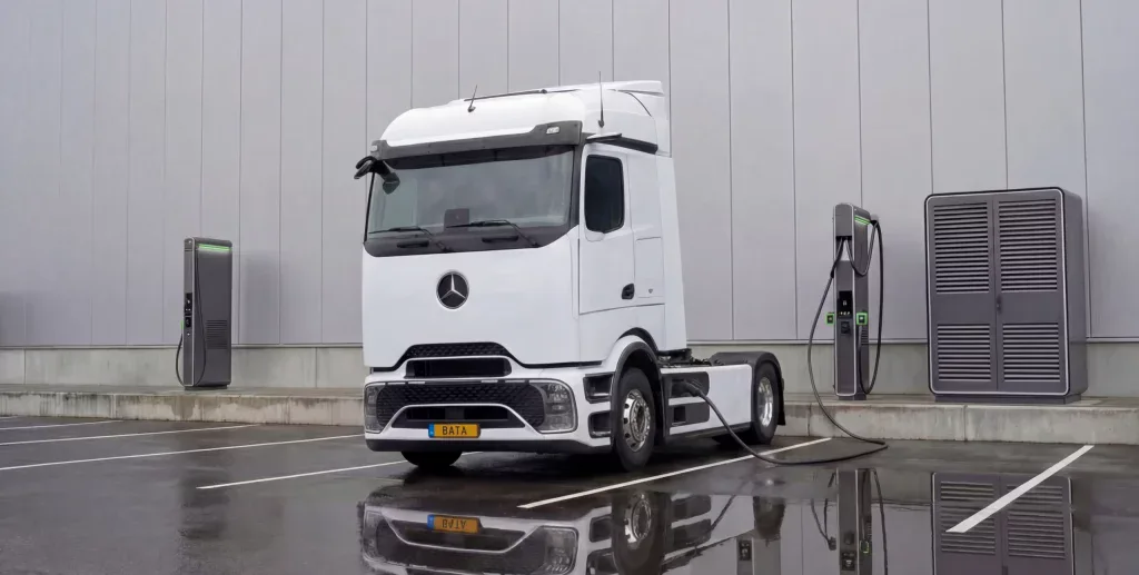 Charging an electric truck at a charging station, sustainable transport solutions.