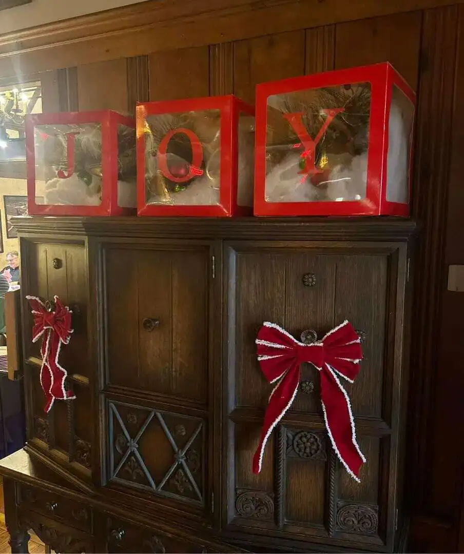 Holiday-themed Cascades Manor display with festive decorations.