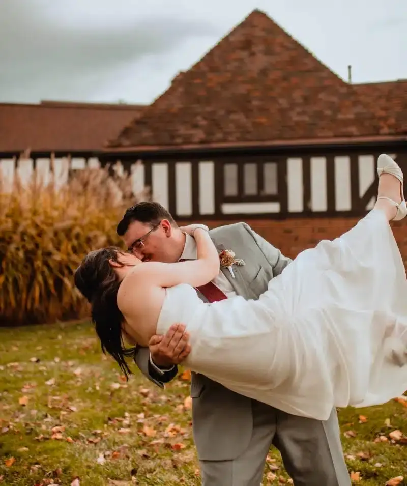 Wedding couple at Cascades Manor estate, romantic moment outdoors.