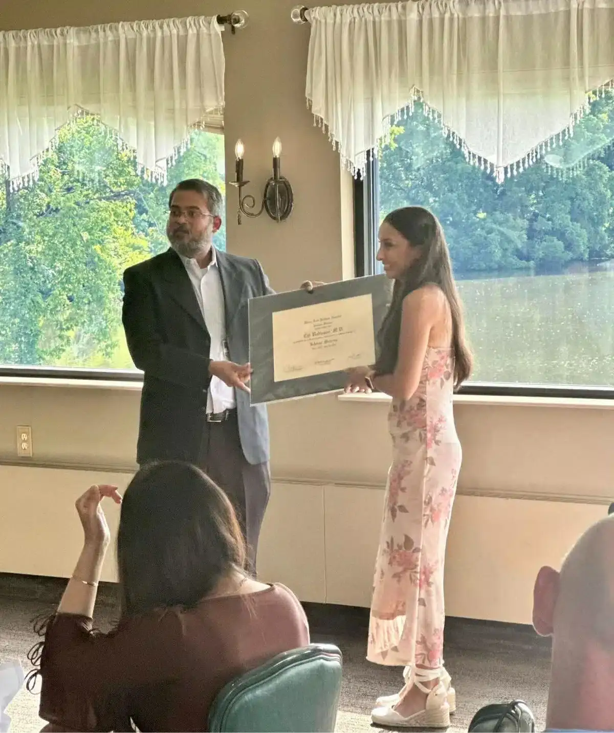 Award presentation at Cascades Manor event venue.