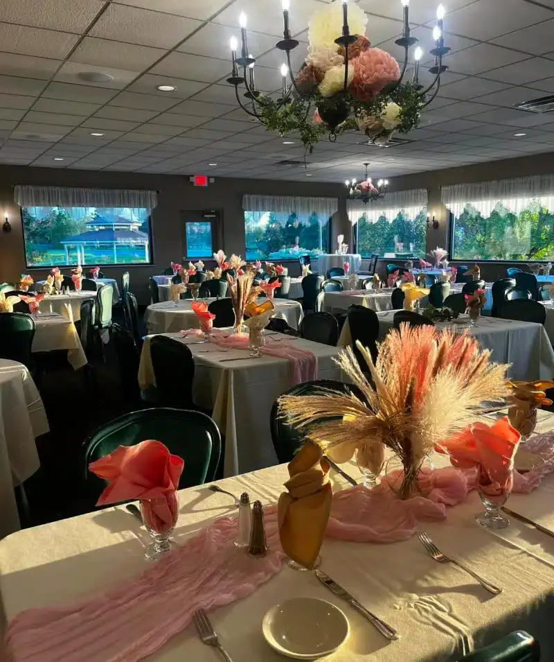 Elegant event setup at Cascades Manor with floral centerpieces and decorated tables.