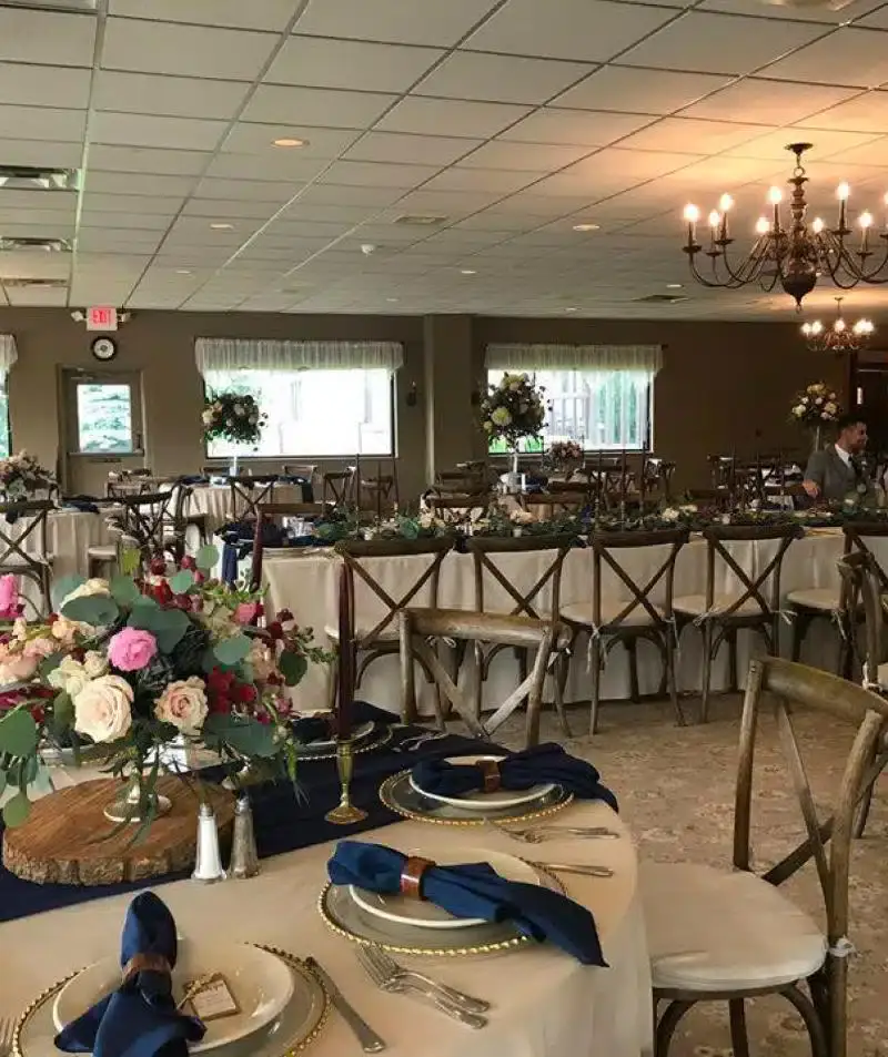 Elegant event space at Cascades Manor with beautifully set tables and floral centerpieces.