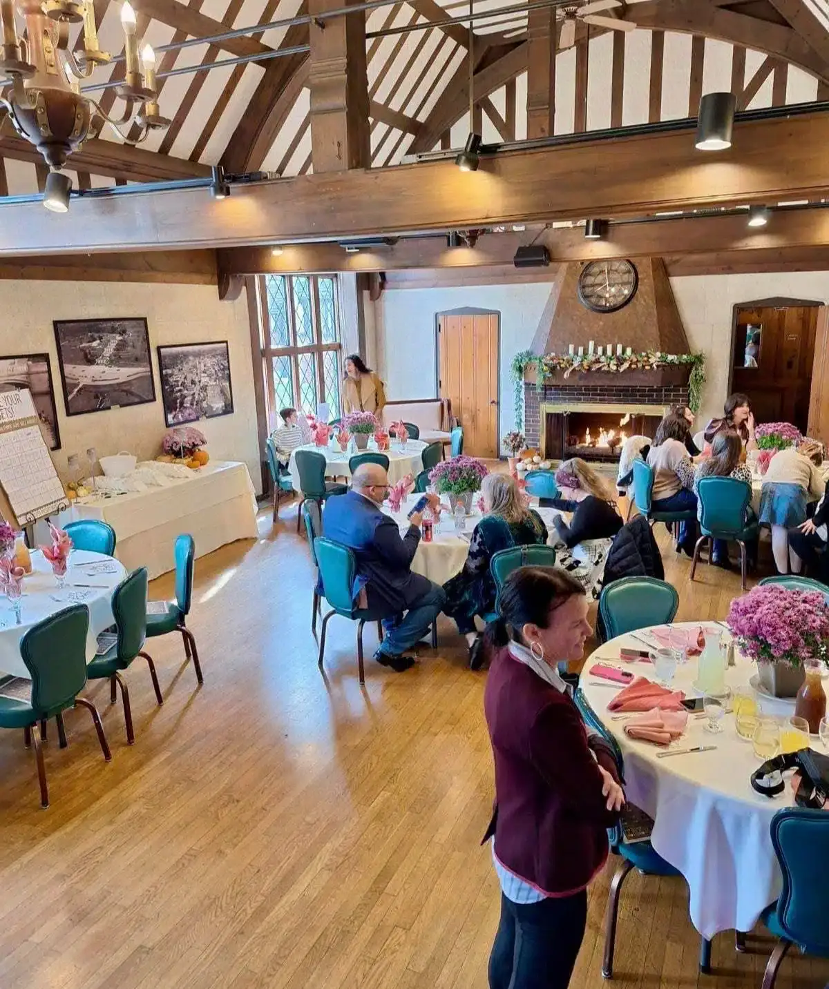 Elegant indoor event at Cascades Manor with guests seated at decorated tables.