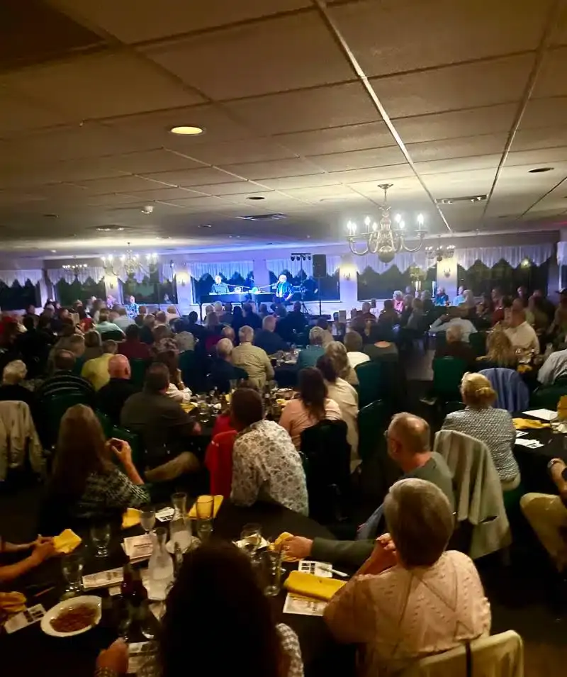 Elegant event at Cascades Manor with live music and a large audience.
