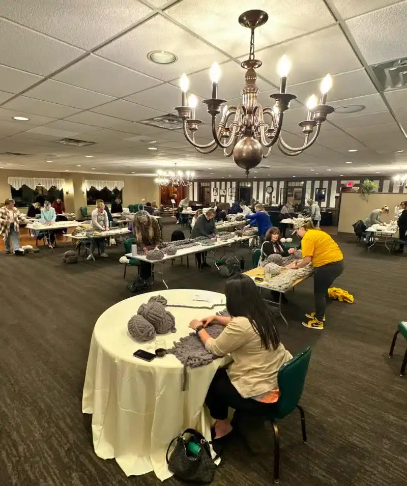 Indoor craft workshop at Cascades Manor with guests engaging in creative activities.