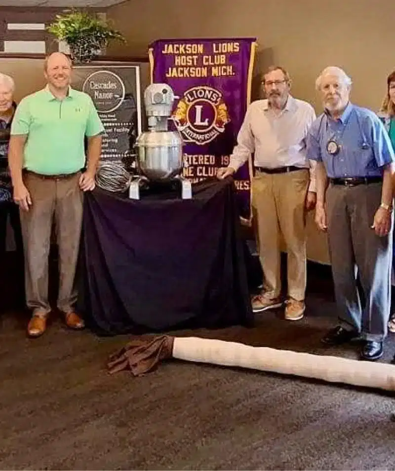 Jackson Lions Club members at Cascades Manor event promoting community service.