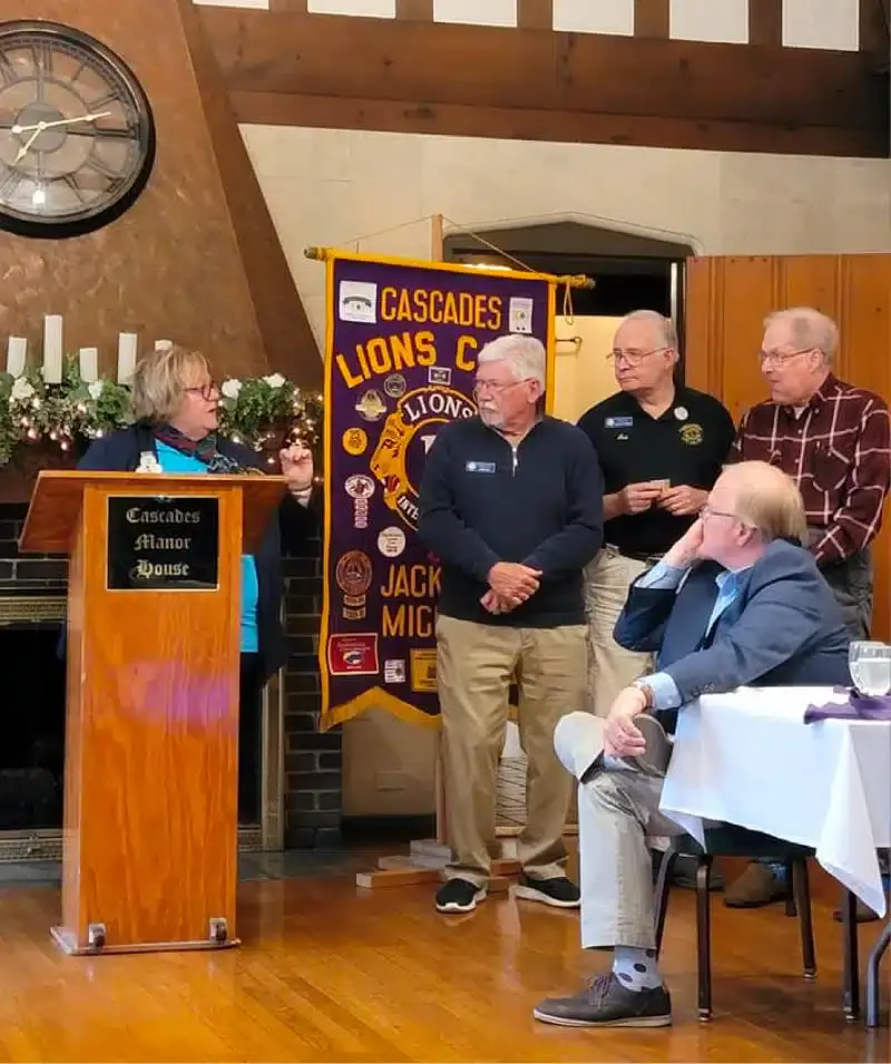 Group of people at Cascades Manor Lions Club event indoors.