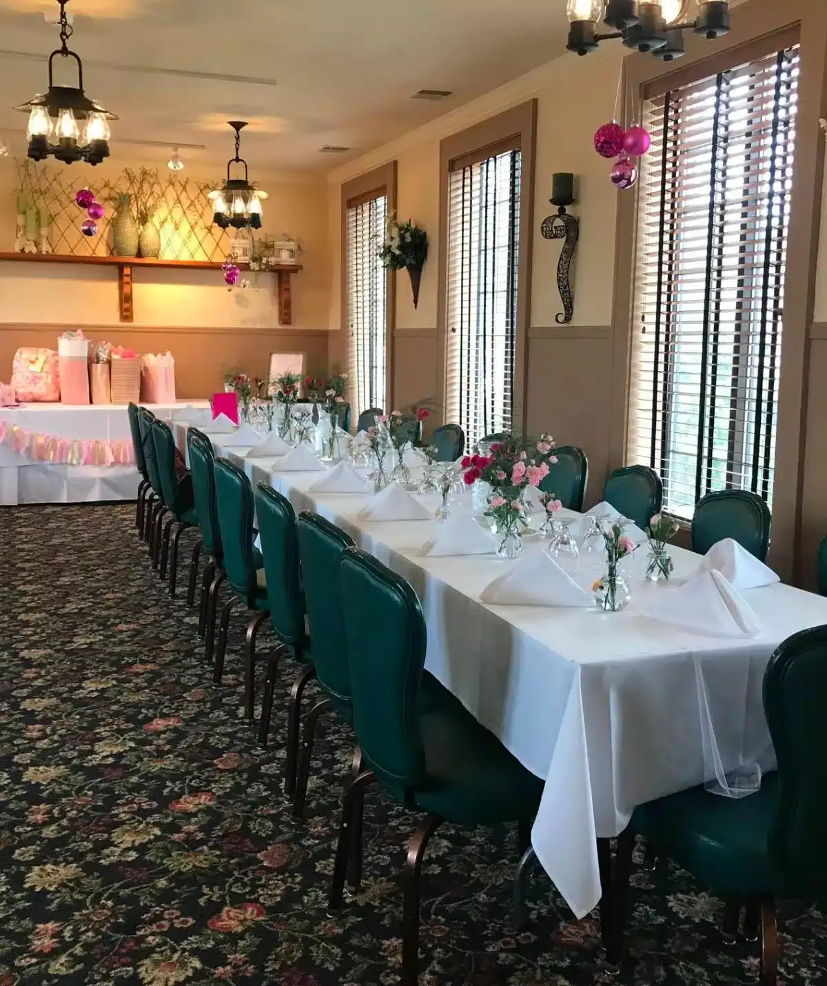 Event space at Cascades Manor with decorated tables and floral centerpieces.