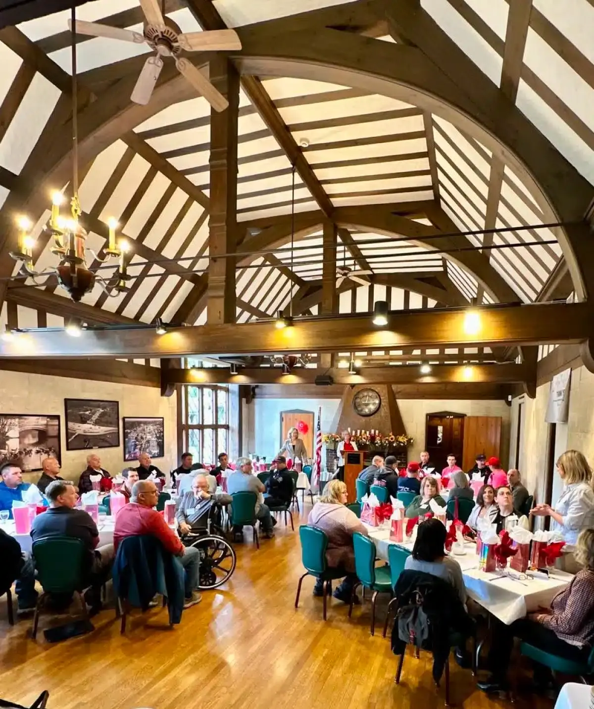 Event space at Cascades Manor with high vaulted ceilings and wooden beams.