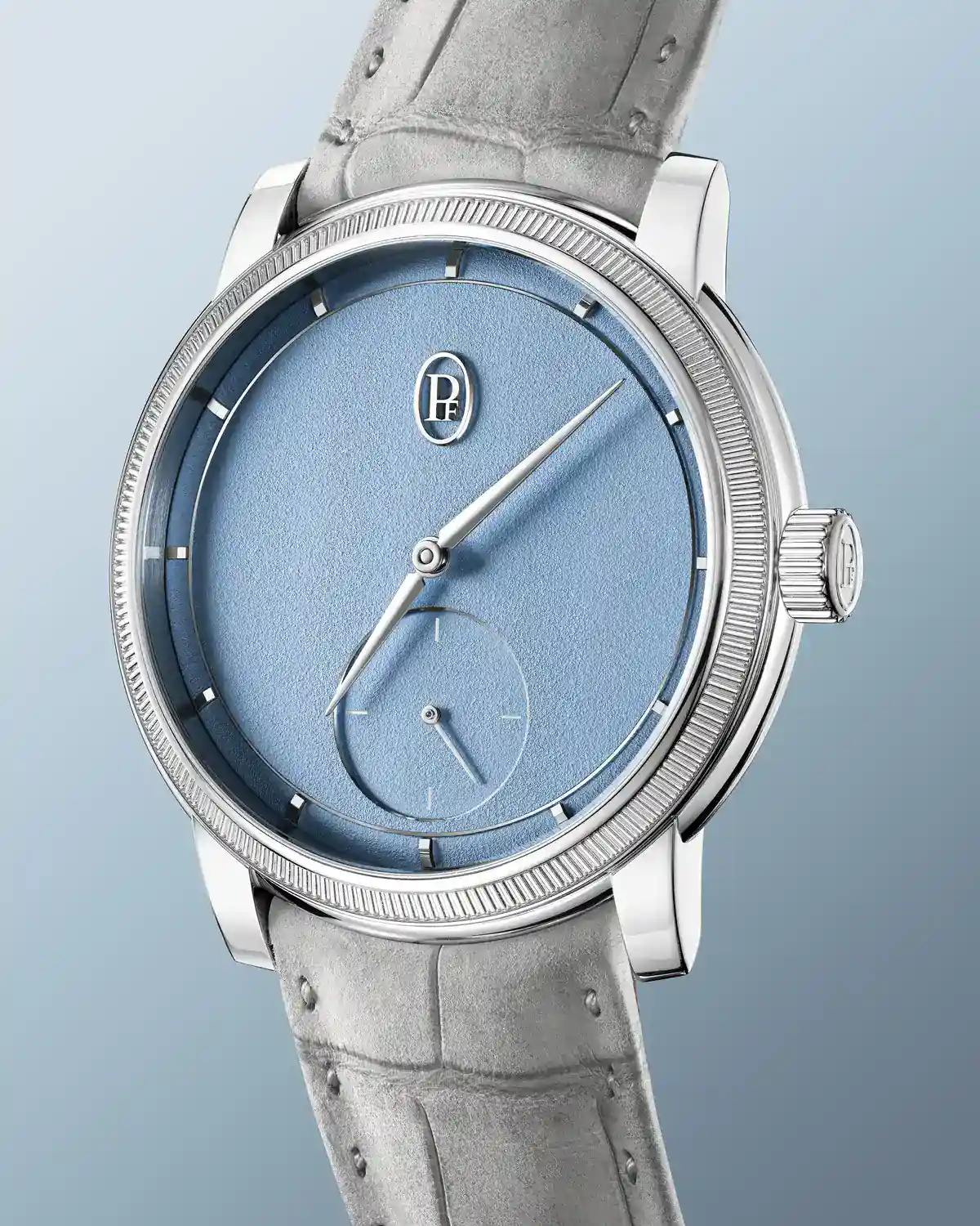 Three-quarter view of the Toric Petite Seconde Morning Blue showing the hand-grained 18k white gold dial, PF emblem and knurled platinum bezel