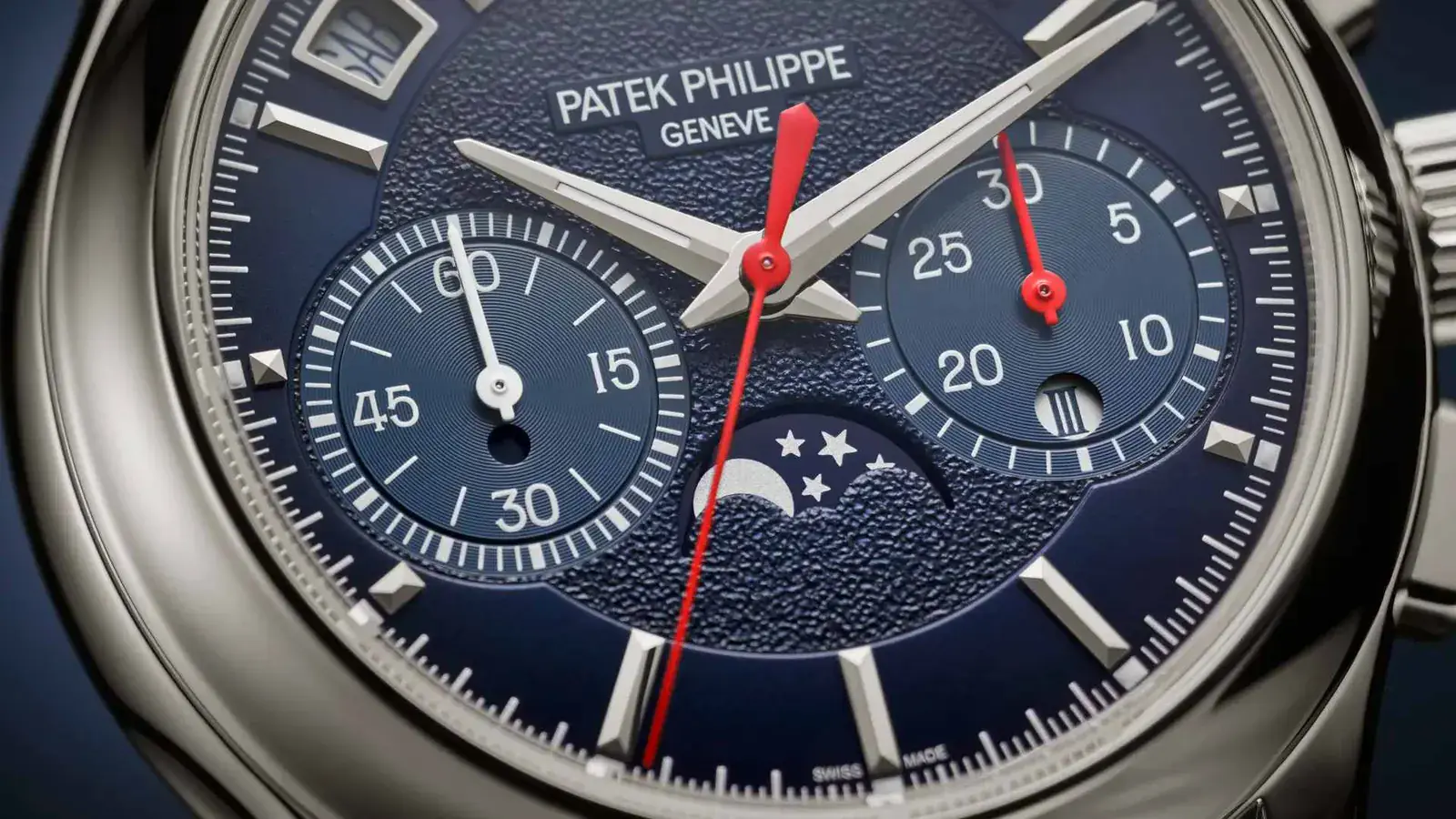 Close-up of the Patek Philippe 5978P-010 navy blue dial with textured center, moon phase and instantaneous 30-minute counter