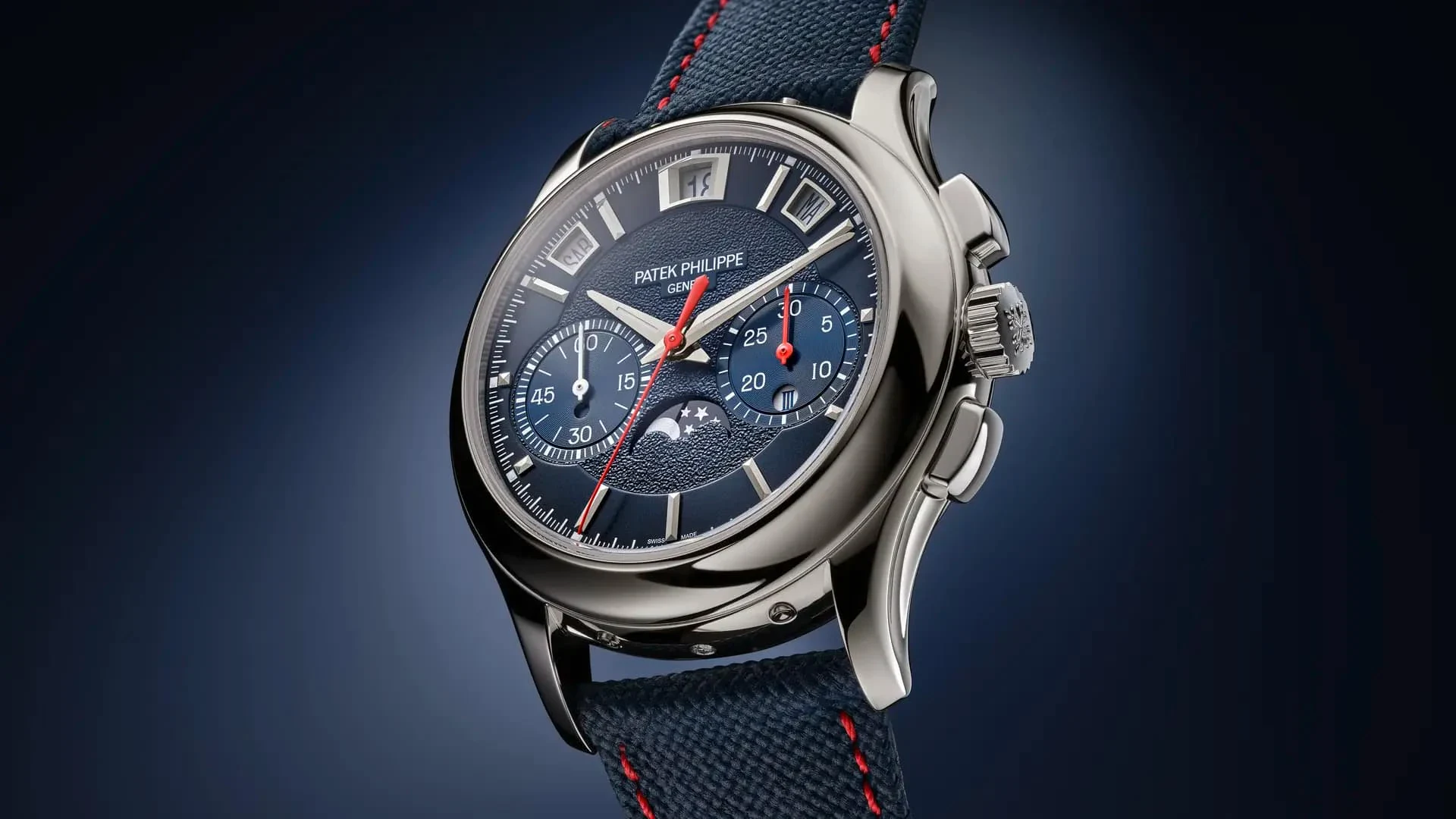 Patek Philippe 5978P-010 in platinum with sunburst navy blue dial, calendar apertures, red chronograph hands and navy blue fabric-pattern strap