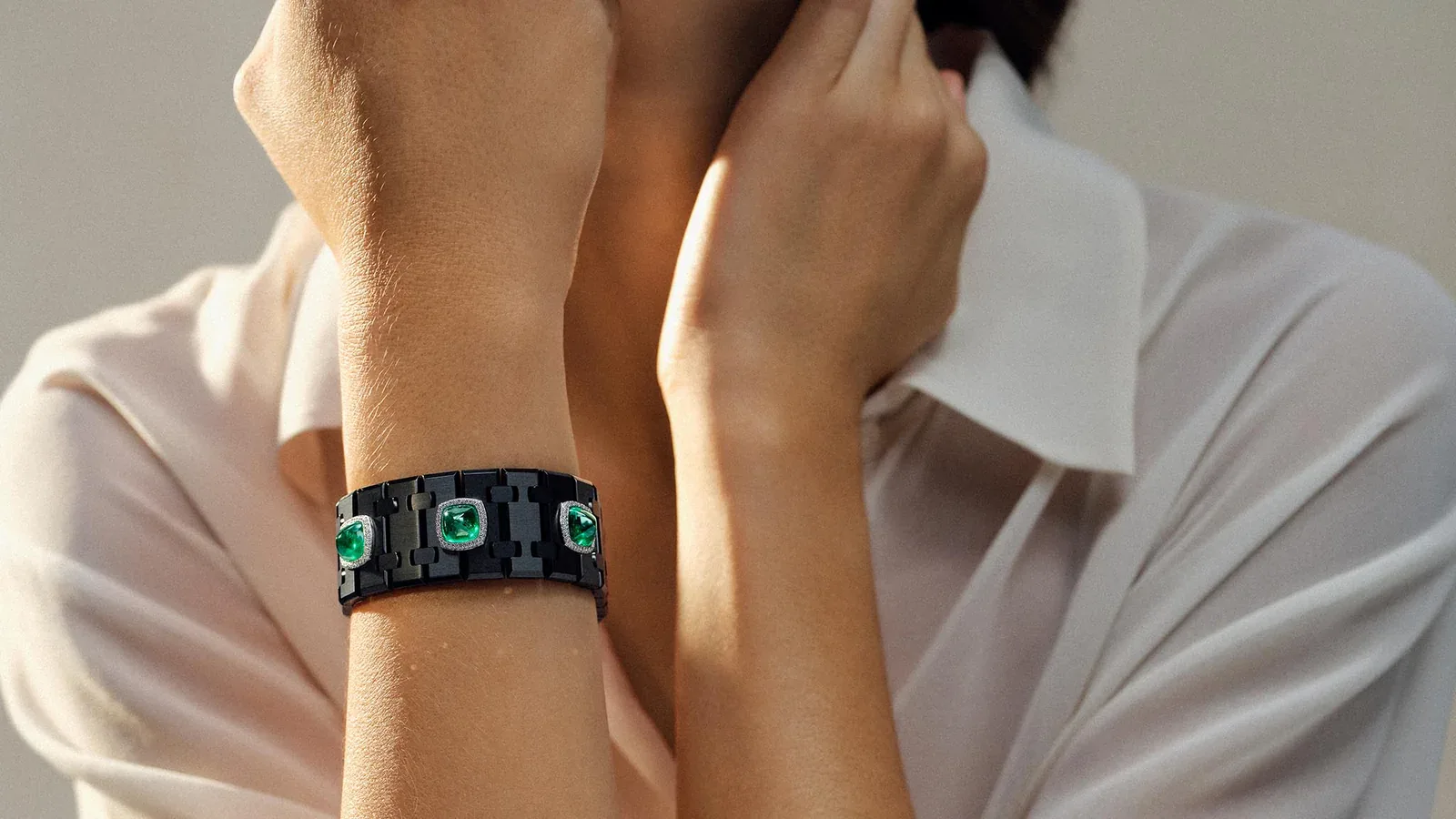 The Risoud Eclipse cuff, set with three sugarloaf emeralds of approximately 12 carats and fastened with the octagonal Royal Oak clasp / Photo Credit: Audemars Piguet
