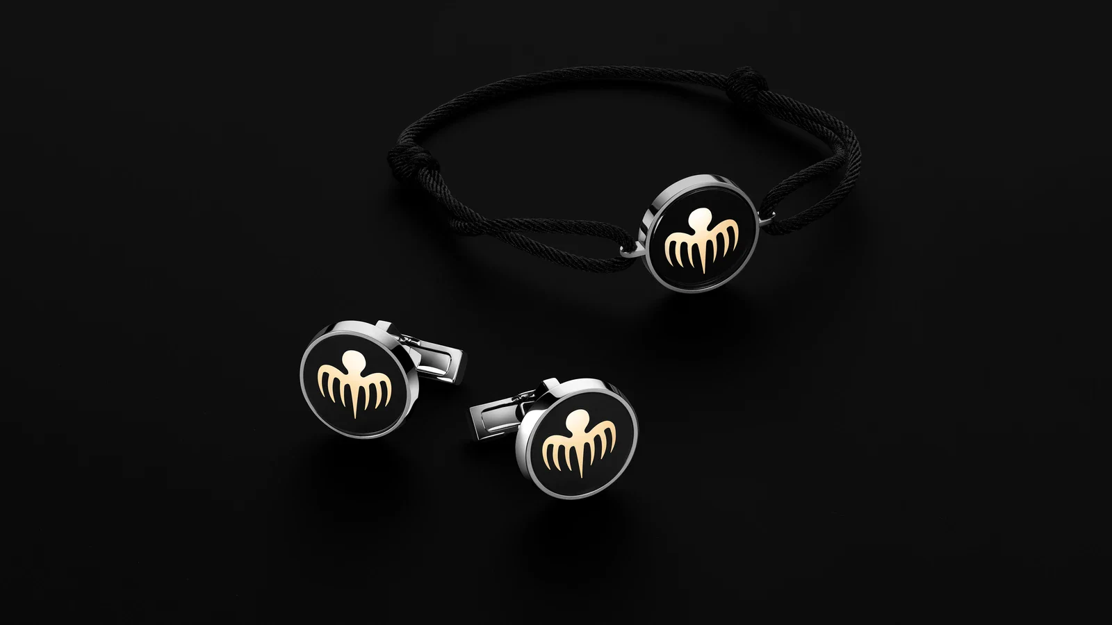 Cufflinks and black cord bracelet bearing the Spectre octopus emblem, from the Spectre limited-edition set of the Omega Seamaster James Bond Spectre collection