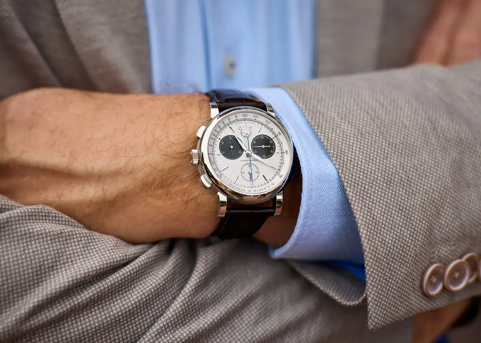 A. Lange & Söhne TRIPLE SPLIT chronograph with silver dial and dark subdials on a brown strap, worn at the Audrain Newport Concours d'Elegance 2026