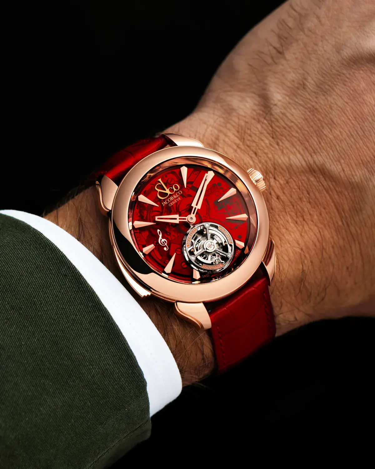 Jacob & Co. Palatial Flying Tourbillon Minute Repeater on the wrist, showing the red dial, G clef appliqué, and flying tourbillon at 6 o'clock