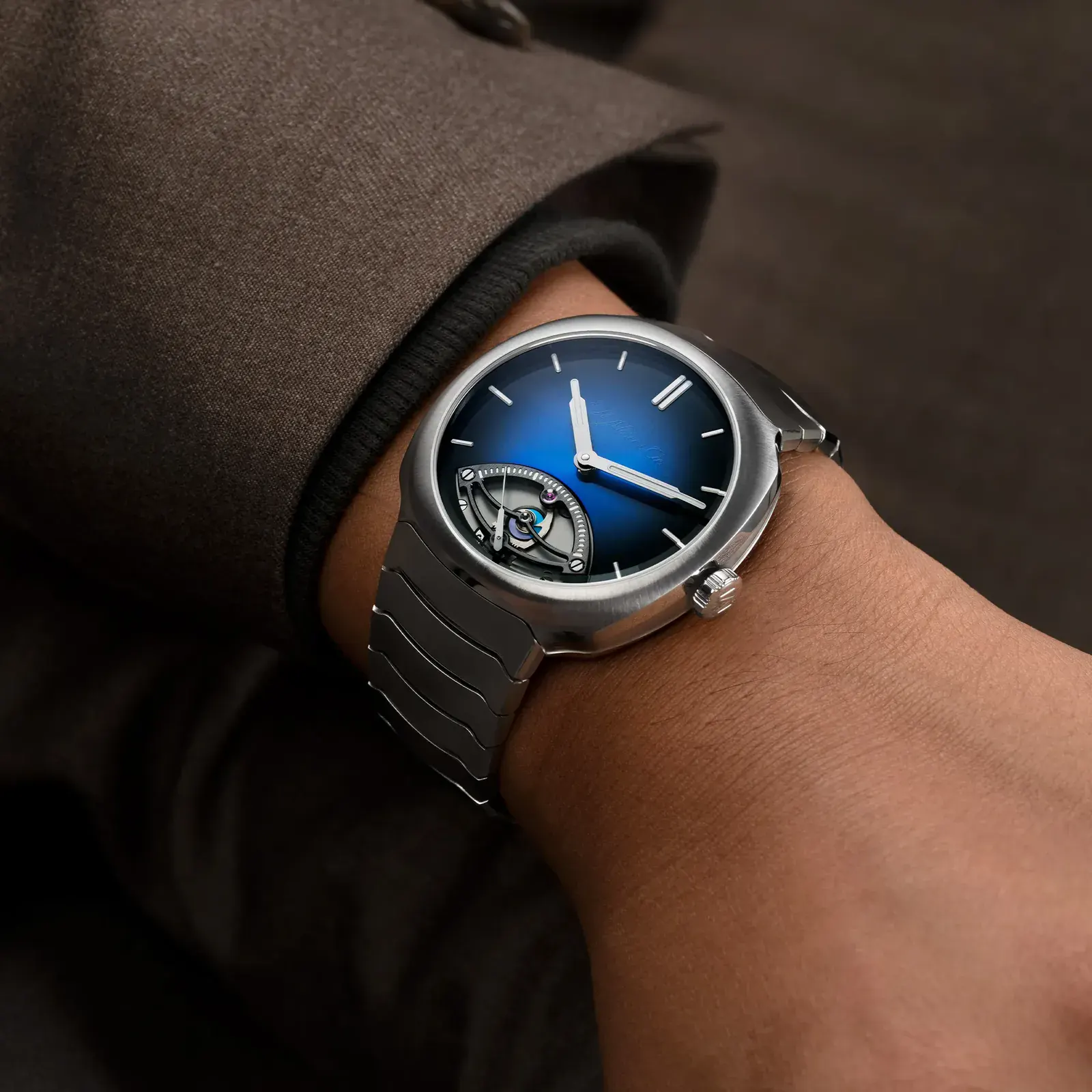 H. Moser Streamliner Retrograde Seconds watch on the wrist with integrated steel bracelet