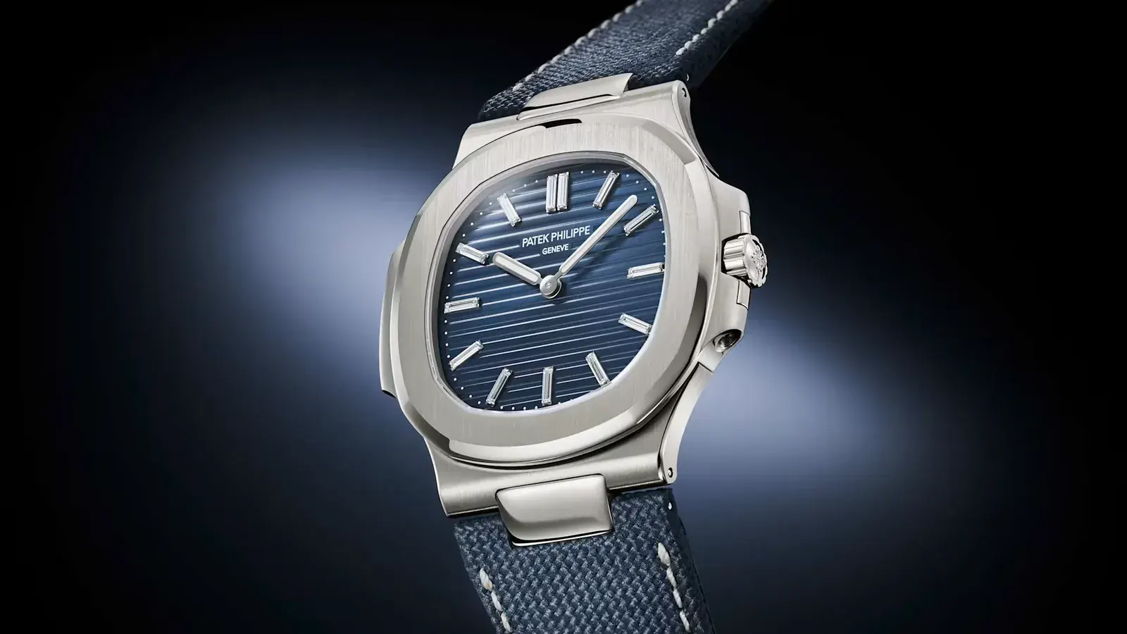 Messi Patek Philippe Nautilus 5810G-001 in three-quarter view, white gold case, crown and navy fabric strap