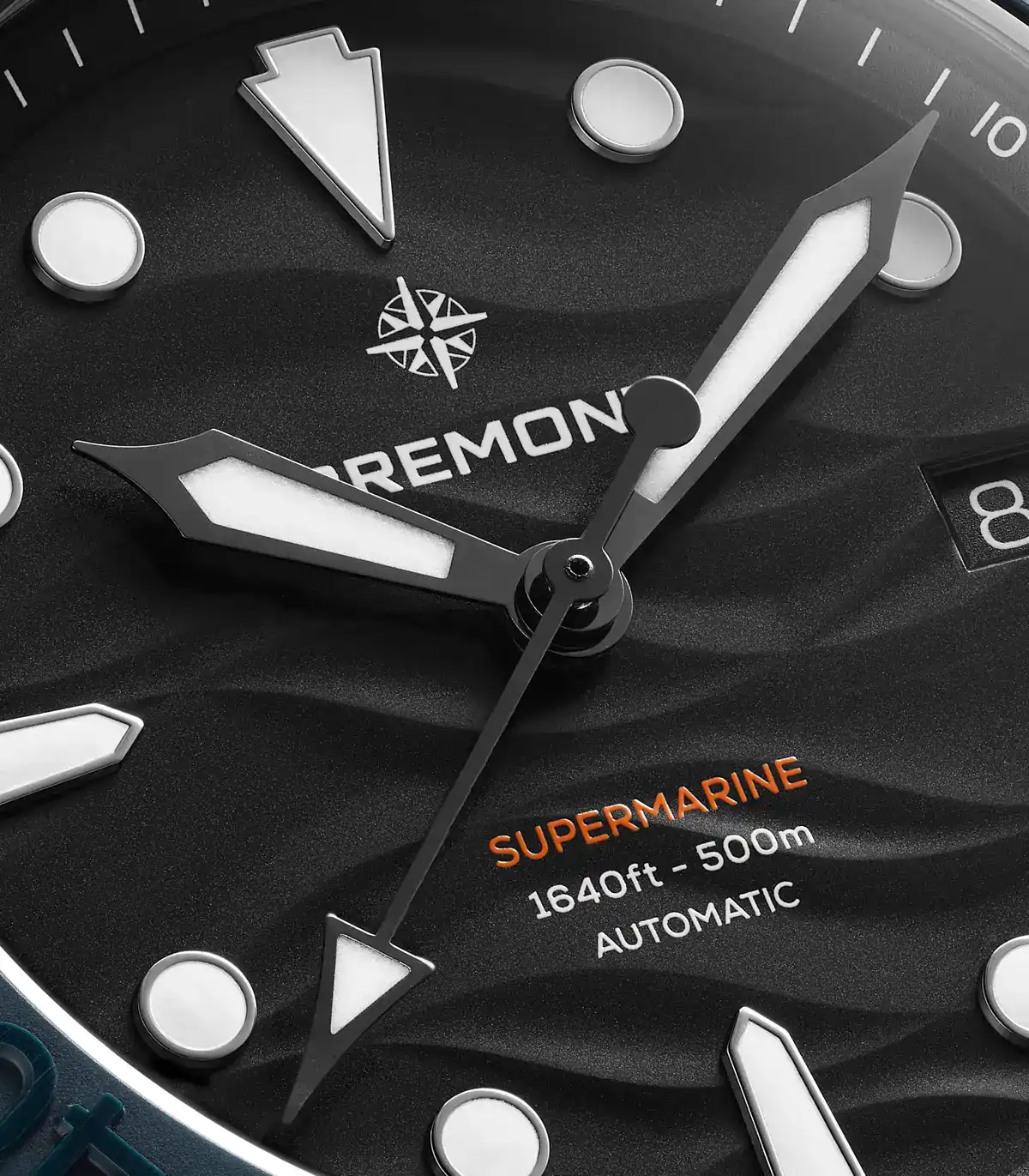 Bremont Supermarine Full Ceramic Deep Blue black wave-effect dial with trapezoid indexes, orange Supermarine text, and date at 3 o'clock