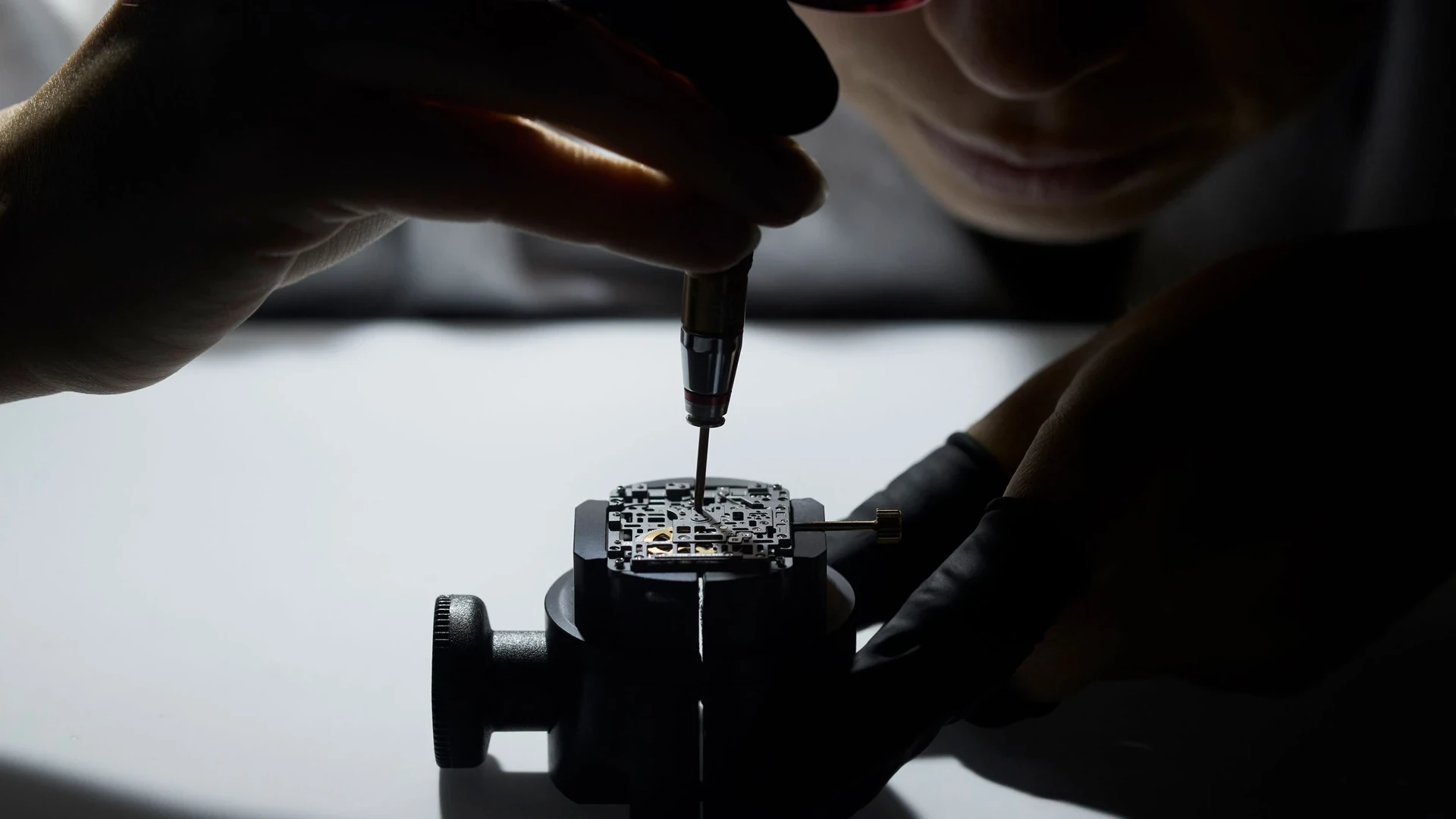 A Richard Mille watchmaker assembles an RM 16-02 movement at the bench, illustrating the Jeremy Strong Richard Mille story