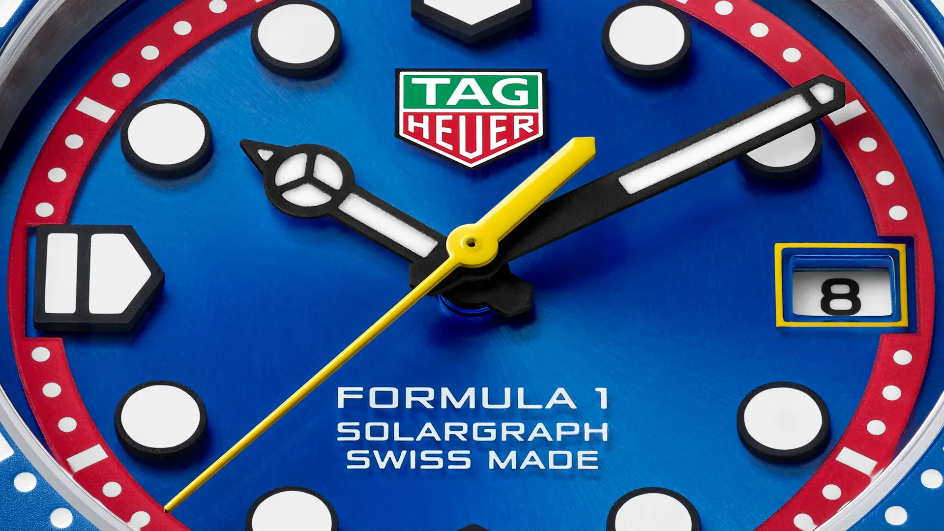 TAG Heuer Formula 1 Solargraph x Oracle Red Bull Racing close-up of the blue sunray dial, red flange and yellow seconds hand