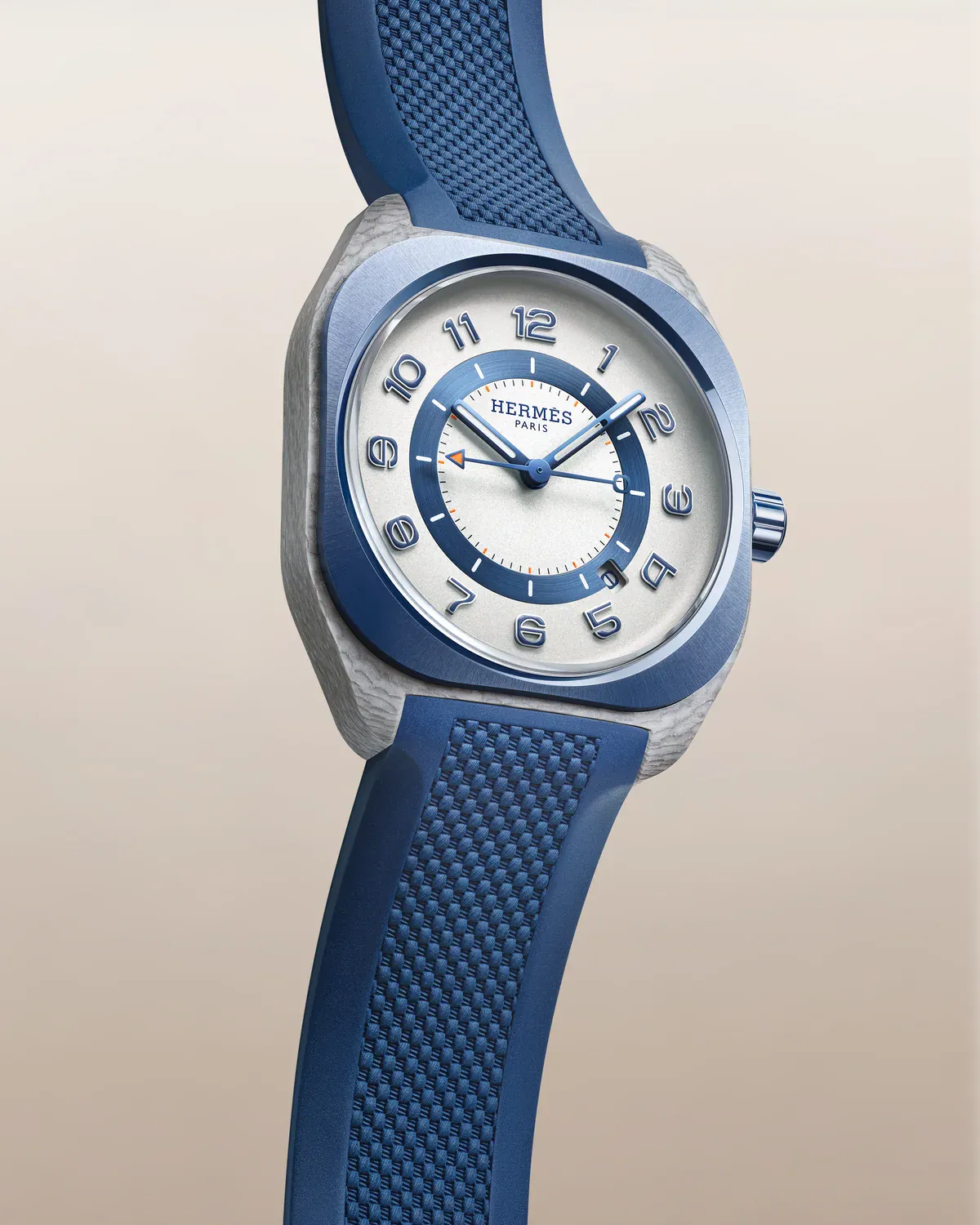 Three-quarter view of the Hermès H08 Bleu de Malte showing the cushion-shaped composite case and blue ceramic bezel