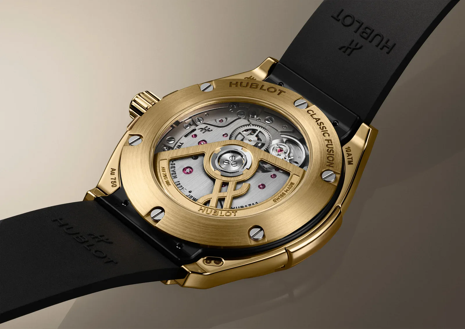 Sapphire caseback of the Hublot Classic Fusion Tributo in yellow gold showing the HUB1711 self-winding caliber and H-shaped gold oscillating weight