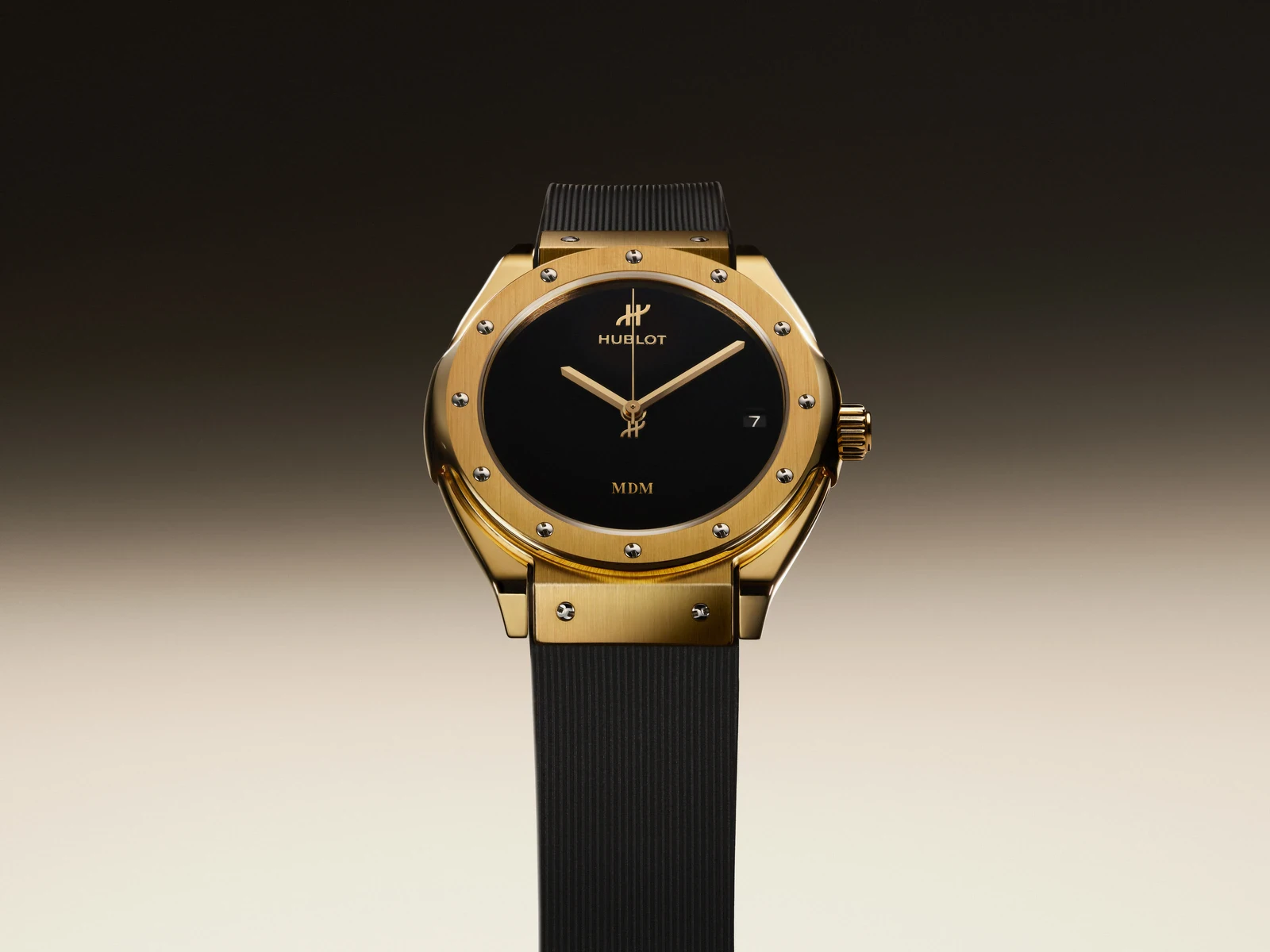 Hublot Classic Fusion Tributo in 18k yellow gold with black dial and black lined rubber strap