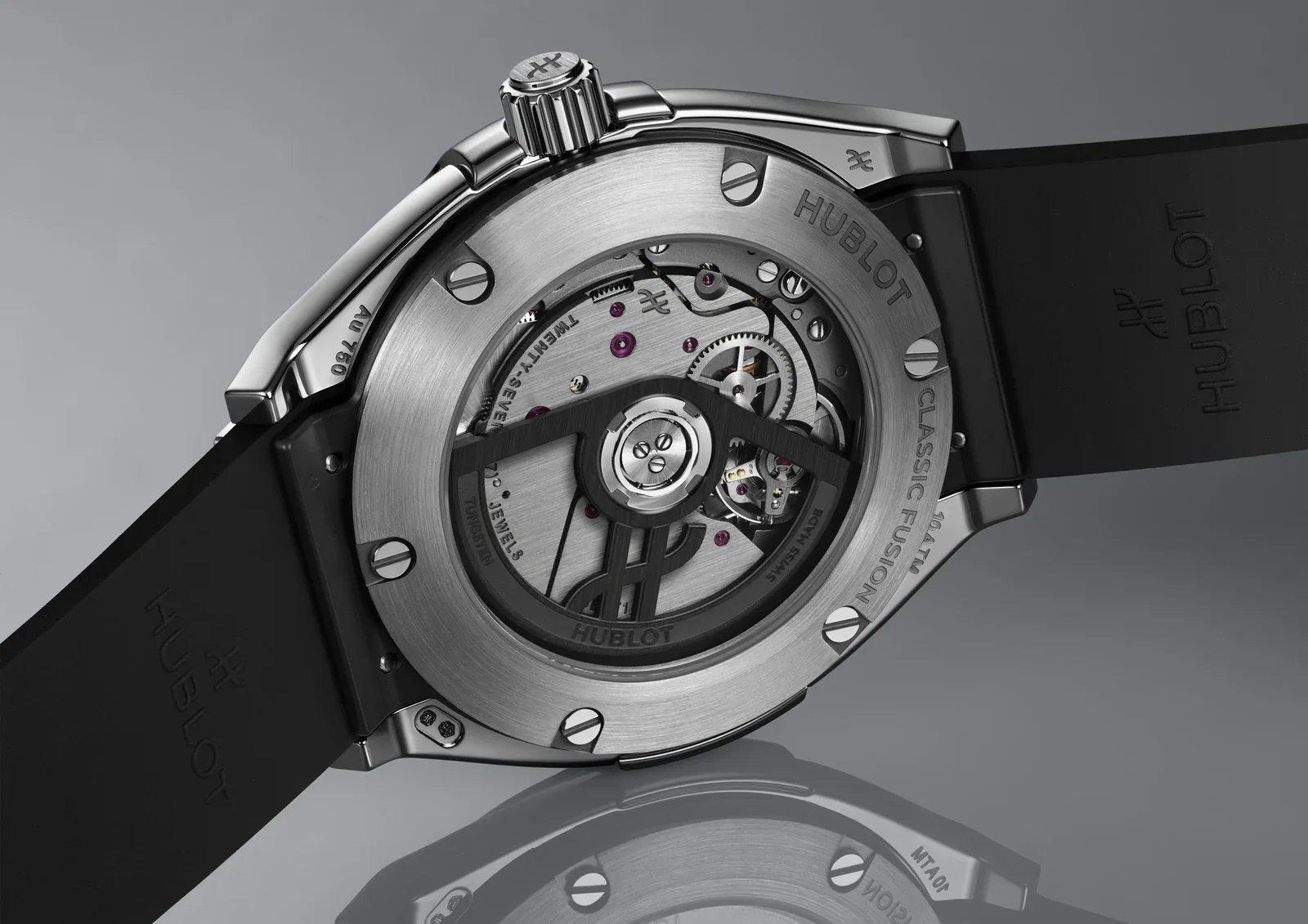 Caseback of the Hublot Classic Fusion Tributo in white gold showing the black tungsten oscillating weight and HUB1711 movement