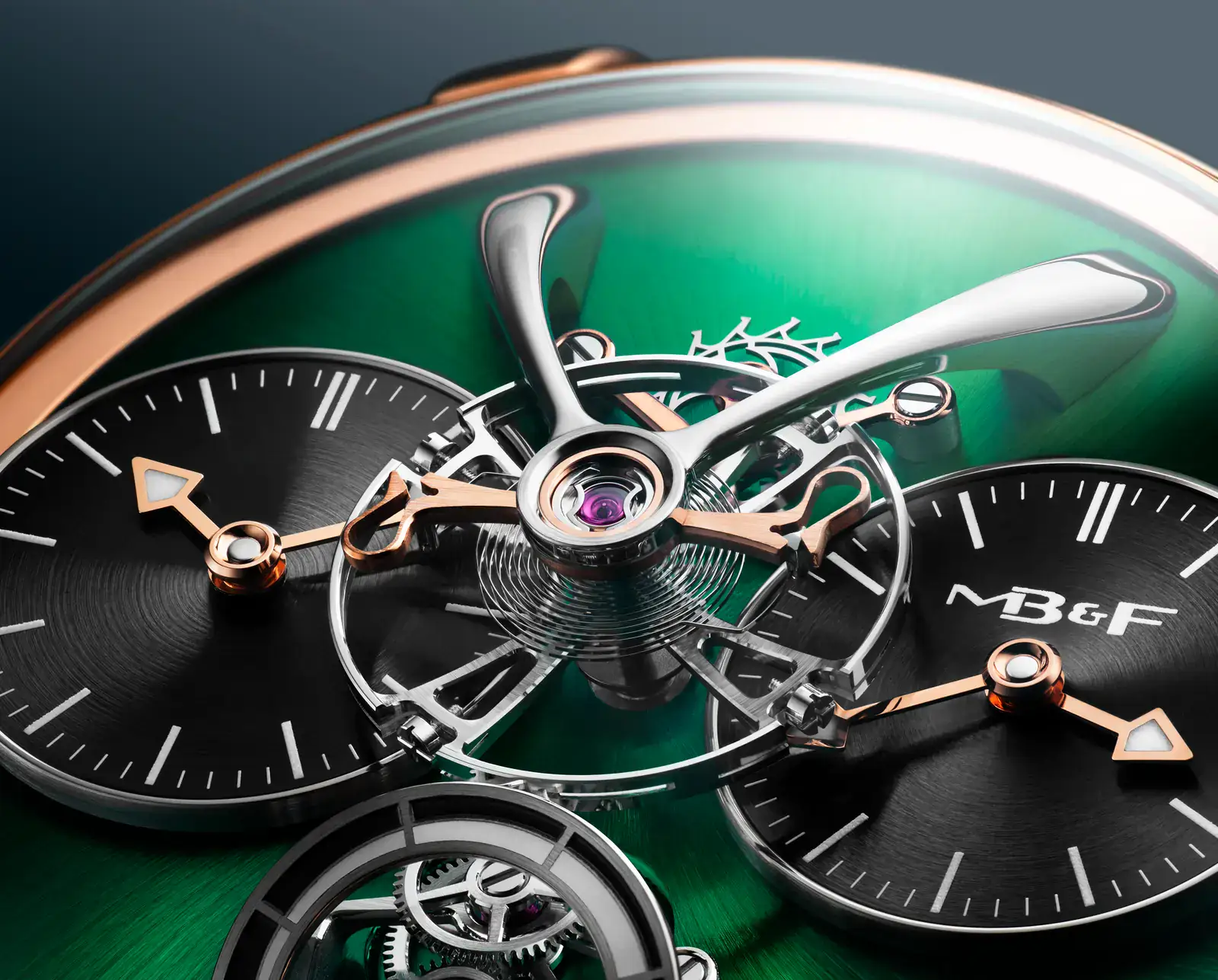 Close-up of the MB&F LM1 EVO balance wheel and double hairspring over the green rose gold dial plate