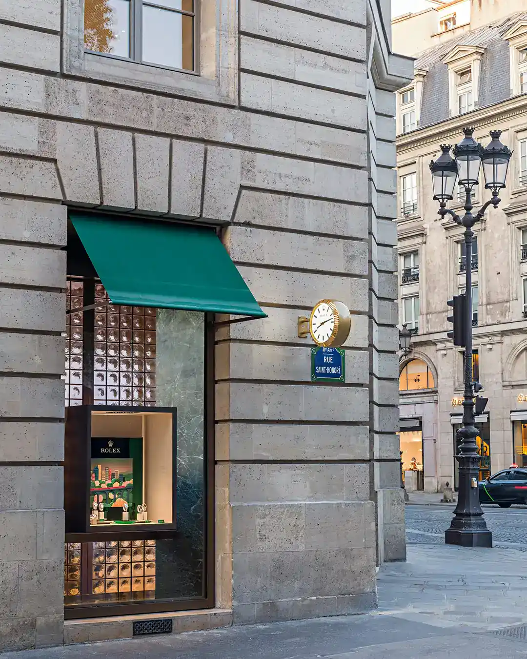 Close-up of the Rolex boutique Paris facade on Rue Saint-Honoré with its Rolex clock