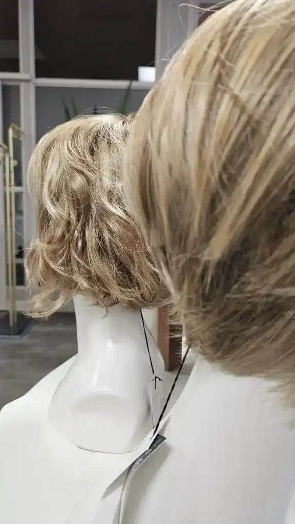 Multiple blonde wigs on display mannequins at Hidden Secrets Wigs store.