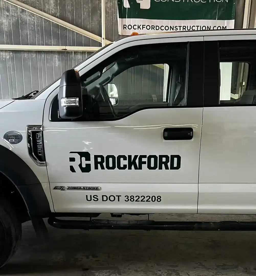 Service truck with Rockford Construction logo and DOT number.