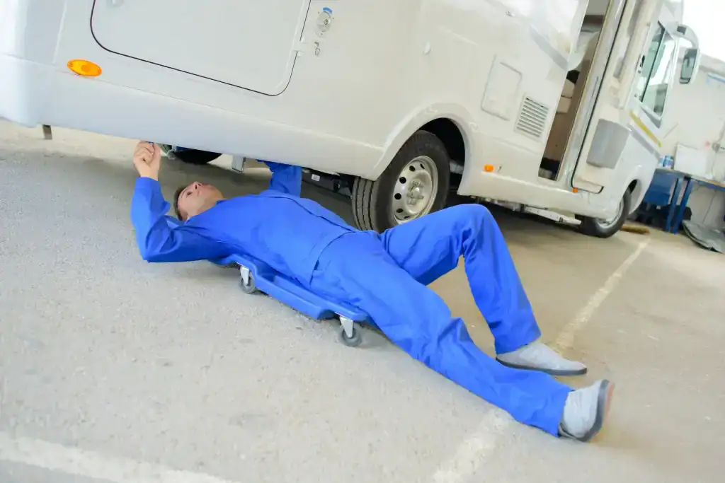 RV repair technician working on a motorhome in DeLand, Florida.