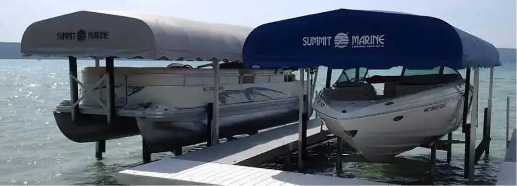 Summit Marine boat dock with two covered canopies and boats moored at the marina.