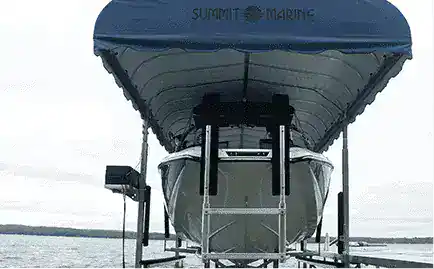 Boat on lift at Summit Marine marina.