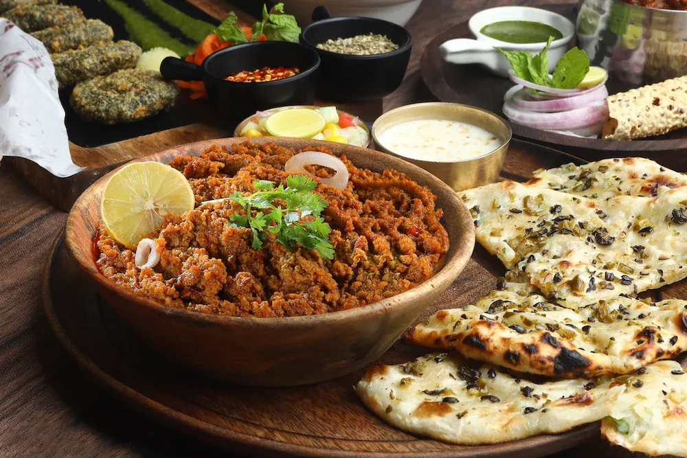 keema rice served with nan bread and traditional Indian pickles