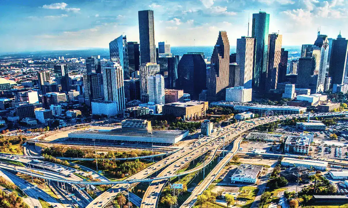 Modern U.S. city skyline with energy infrastructure and skyscrapers.