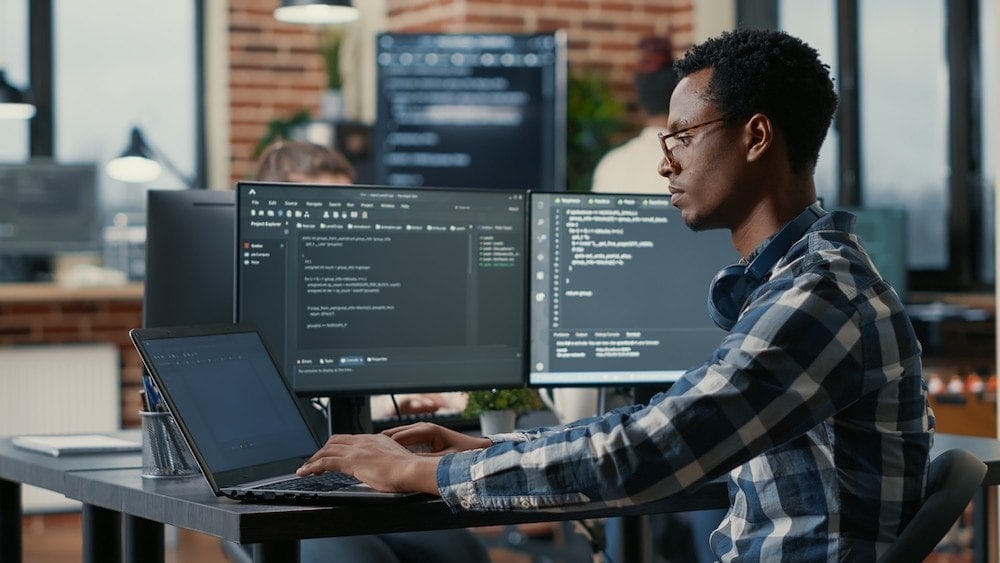 Man sitting at desk looking at computer screen| How Does GPR Surveying Work? | US Radar