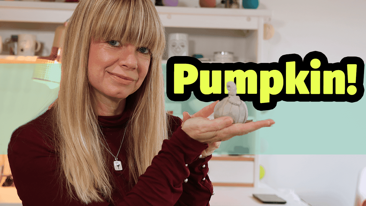 Lisa holding a ceramic pumpkin