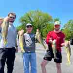 Three customers show off their catch while fishing with Badock Fishing Guide Service while at Table Rock Lake in southwest Missouri near Branson.