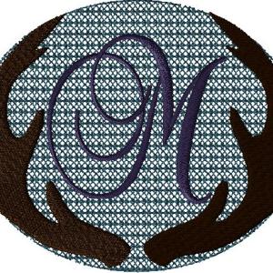 Antlers with a knockdown stitch and an alphabet letter:M
